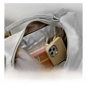 Top view of silver metallic bucket bag showing interior storage capacity for a phone