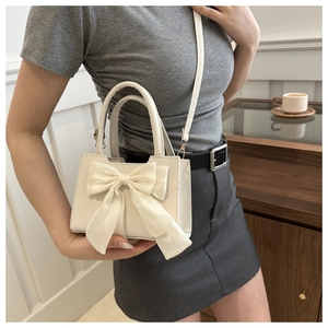 Chic beige bow-knot crossbody bag for women with elegant satin ribbon detail