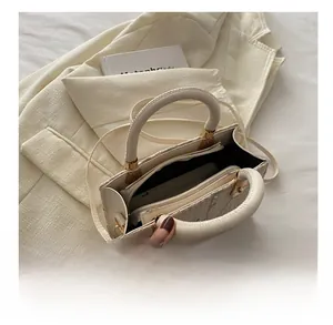 Spacious interior of the woven lace tote bag with a zipper pocket for daily essentials