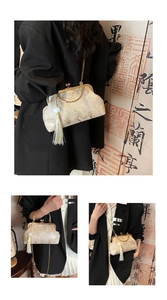 Detailaufnahme der Seidenhandtasche mit Blumenstickerei und elegantem Metallringgriff