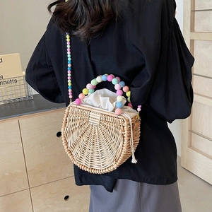 Semicircular woven straw handbag with colorful acrylic bead chain and drawstring liner