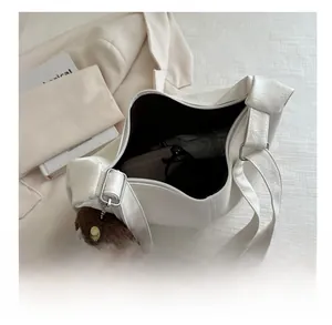 Interior view of beige litchi grain tote showing capacity for umbrella and wallet