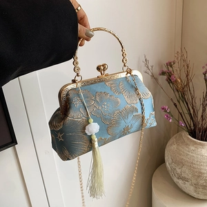 Elegant light blue Chinese silk embroidery handbag with golden tassels and metal handle
