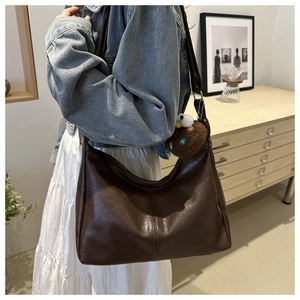 Minimalist dark brown oversized PU leather tote bag with a soft lychee pattern texture