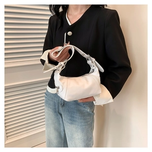 Minimalist white faux leather baguette bag with silver hardware for casual styling