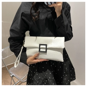 White lychee pattern envelope clutch bag with black square buckle and wrist strap