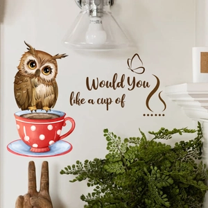 Detail of owl and coffee cup wall sticker with artistic typography on a home wall