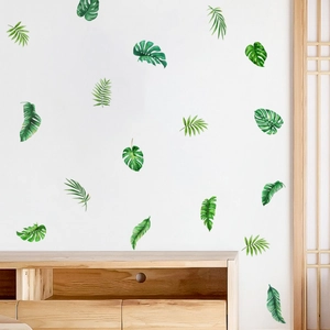 Macro detail of tropical monstera and palm leaves wall decals in watercolor style
