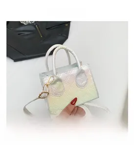Detailed macro of iridescent quilted crossbody bag showing colorful laser texture