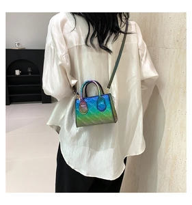 Rear view of a model wearing the gradient quilted mini bag with a slim shoulder strap