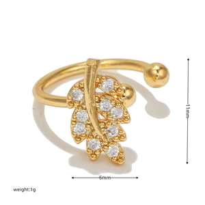 Detailed view of leaf-shaped gold ear cuff with white zircons and 11mm dimensions