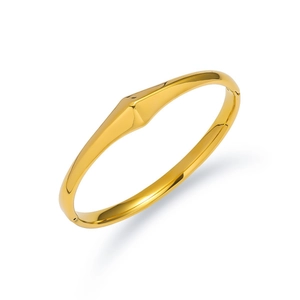 Polished gold stainless steel bangle with geometric facet and secure clasp closure