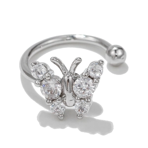 Detail of silver butterfly ear cuff with micro-pave cubic zirconia on white background