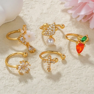 5-piece gold plated ear cuffs set with swan, flower and crystal carrot designs