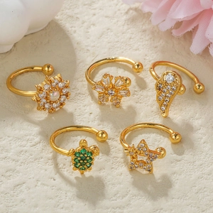 Detailed close-up of 5pcs gold-plated ear cuffs featuring star, turtle, and flower motifs