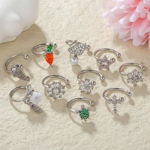 Elegant silver ear clips with sparkling crystals and pearls in various artistic shapes