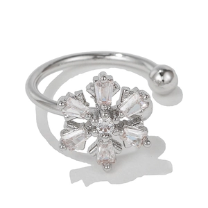 Macro shot of silver adjustable snowflake ring with rectangular cut cubic zirconia stones