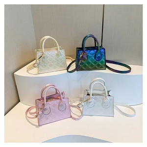 Quilted mini square bags in iridescent pearly finishes with top handles and gold hardware