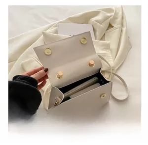 Interior view showing capacity for a smartphone and wallet in white crocodile pattern bag