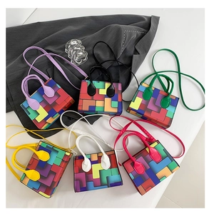 Flat lay of colorful geometric pattern handbags with top handles and shoulder straps