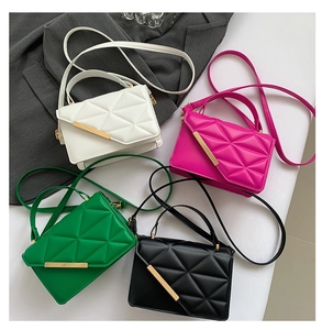 Detailed arrangement of quilted crossbody bags in white, pink, green, and black leather