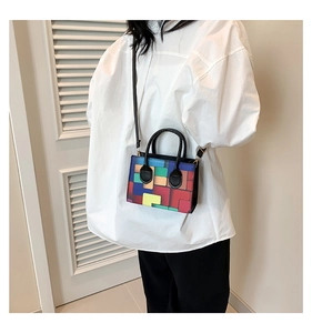 Crossbody model view of a mini square bag with colorful geometric pop art pattern