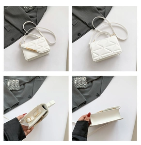 White quilted crossbody bag featuring a golden metal buckle and adjustable strap detail