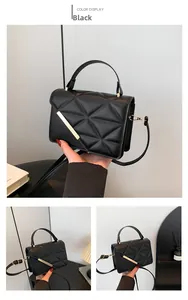 Detailed view of black PU leather quilted handbag with geometric pattern and gold hardware