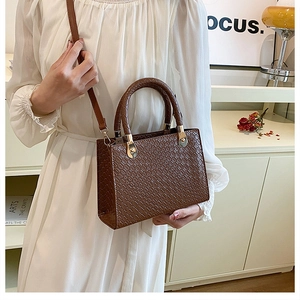 Elegant dark brown crocodile embossed leather handbag with gold hardware for business women