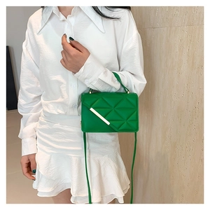 Chic green quilted faux leather crossbody bag for women with gold metal bar accent