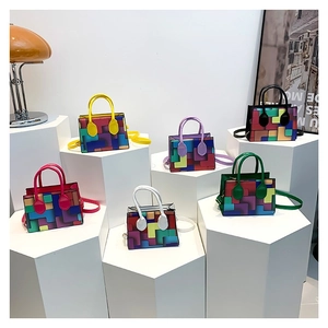Colorful geometric tetris pattern handbag collection with top handles and shoulder straps