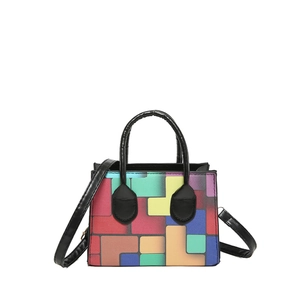 Colorful geometric block handbag with contrasting pattern and black handle for women