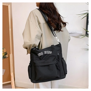 Black canvas tote bag with DUO NING embroidery, large capacity shoulder bag for travel