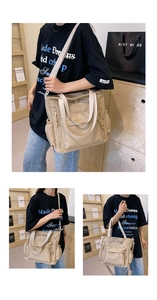 Detail of nylon tote bag showing the side zipper pocket and adjustable strap