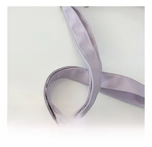 Macro shot of comfortable light purple nylon shoulder strap with precise stitching details