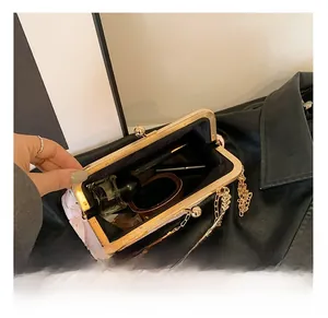 Interior view of pink floral embroidered satin evening bag with metal frame clasp