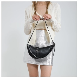 Chic black crescent leather shoulder bag with silver buckle and chunky chain detail
