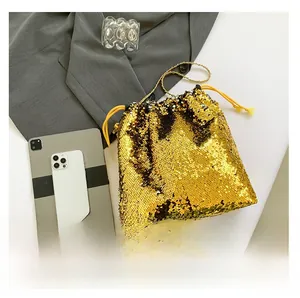 Gold sequin bucket bag size comparison showing storage capacity for mobile phone and tablet