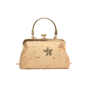 Vintage champagne shell evening clutch with sequin star embroidery and metal handle