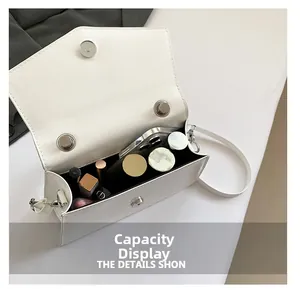 Internal capacity display of white patent leather shoulder bag with magnetic closure