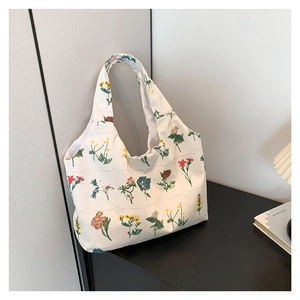 Floral canvas tote bag with colorful flower patterns and wide shoulder straps