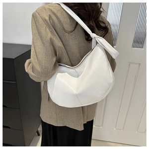 White semi-circle PU leather hobo bag with unique knotted shoulder strap and sleek design