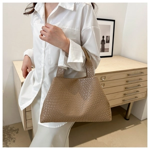 Brown woven lattice tote bag shown as part of a minimalist chic outfit aesthetic