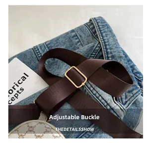 Detail of adjustable strap with gold buckle and mini round vintage pattern coin purse
