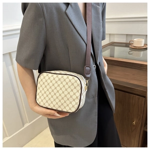 Detail of vintage plaid crossbody bag with luxury pattern and adjustable strap