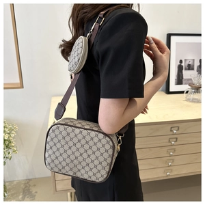 Classic monogram crossbody bag with matching round coin purse on a wide fabric strap
