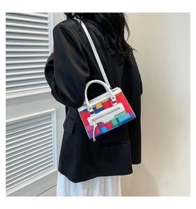 Rear view of a model wearing the colorful Tetris puzzle block handbag with white strap