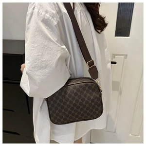 Detail of checkered monogram shoulder bag with wide strap and adjustable gold buckle