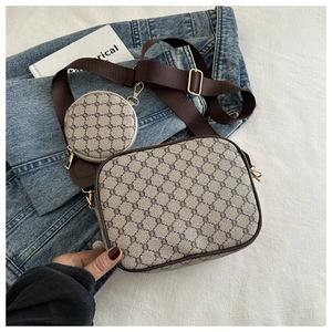 Detail view of retro geometric print crossbody bag set with adjustable wide strap