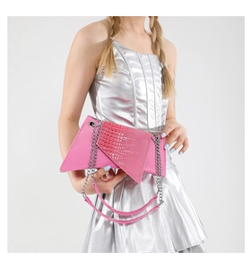 Close-up of pink faux crocodile texture on irregular flap with silver chain strap